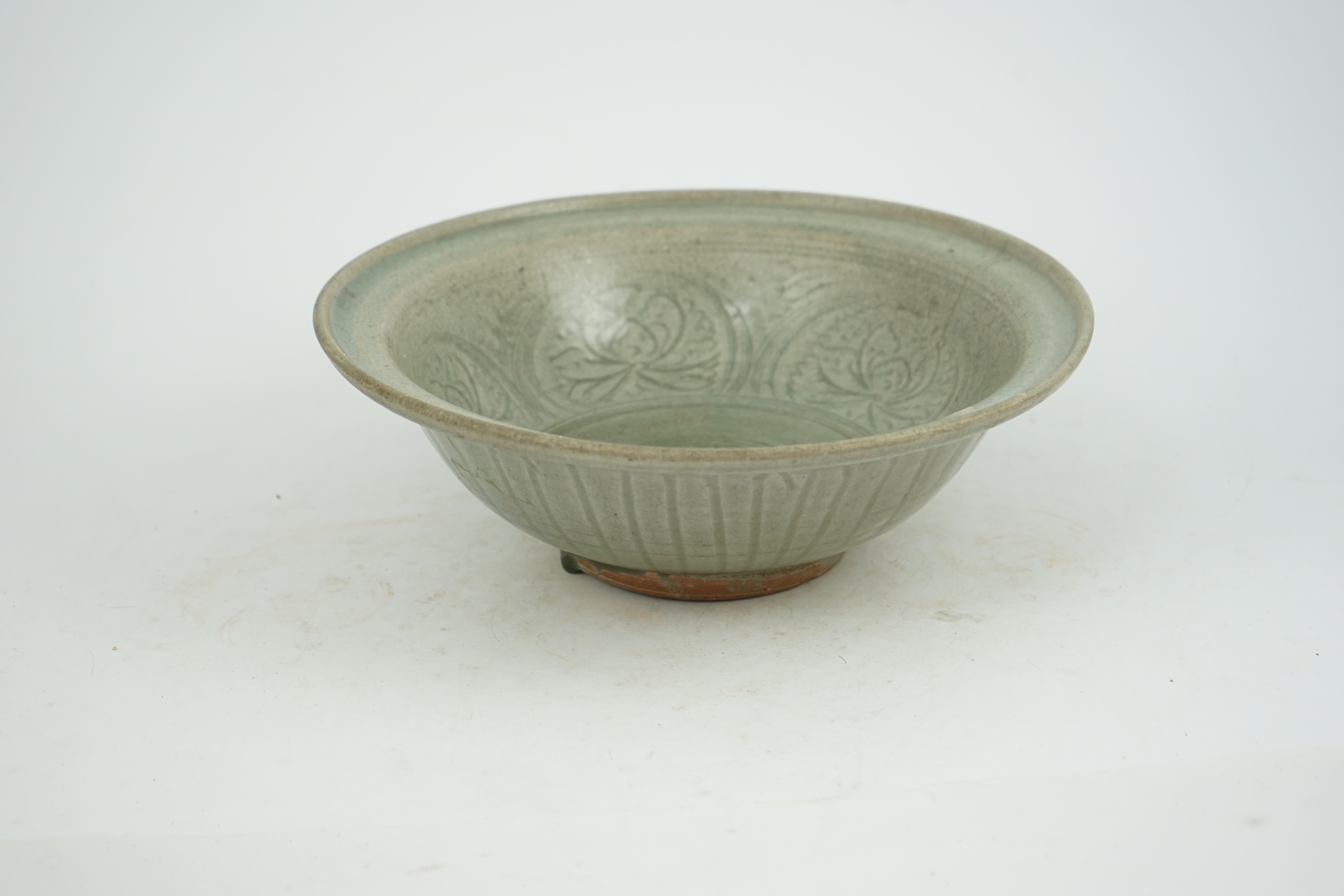 A large Thai celadon glazed bowl, Sawankhalok kilns, 14th / 15th century